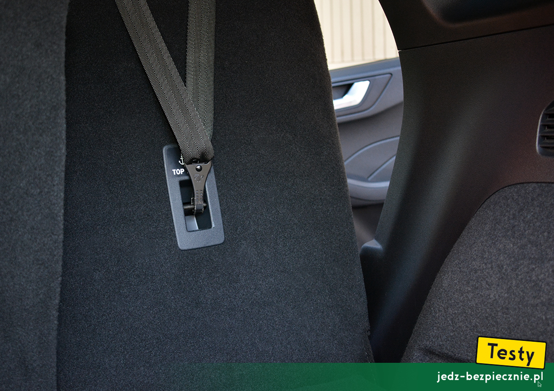 Testy - Ford Kuga III plug-in - próba z zapięciem pasa top-tether fotelika dziecięcego Britax-Romer TriFix, przodem do kierunku jazdy