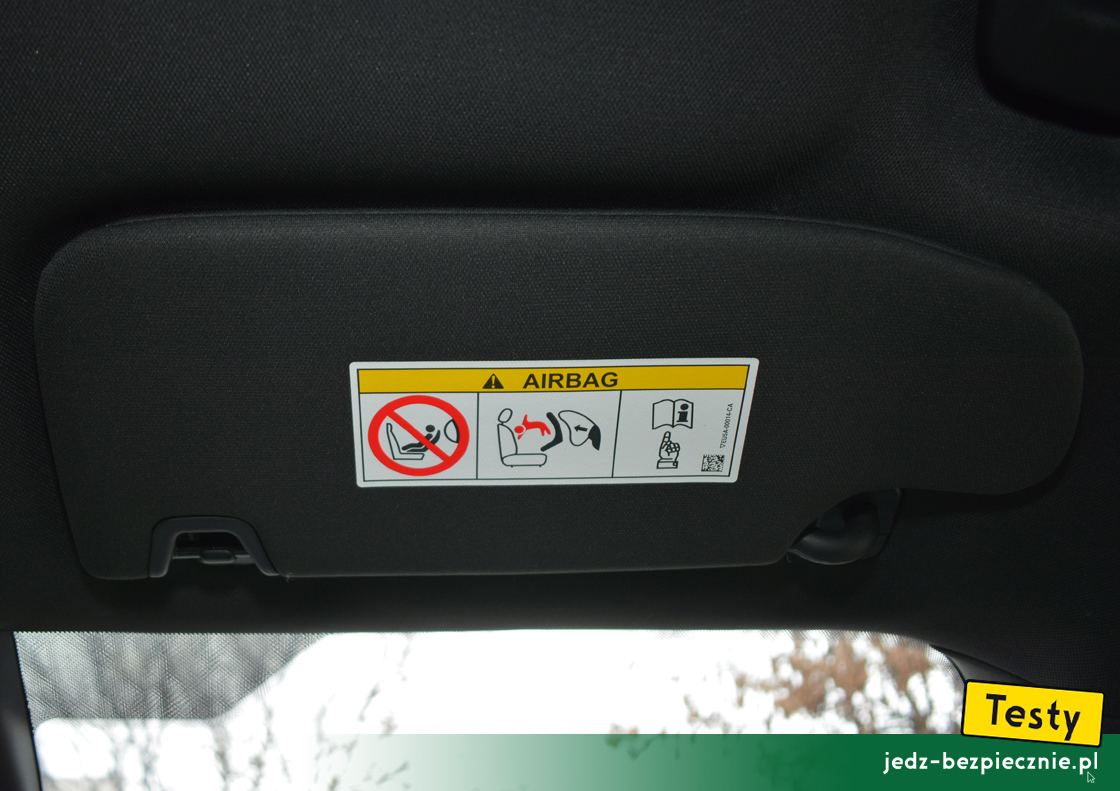 Testy - Ford S-Max hybrid - ostrzeżenie na osłonie przeciwsłonecznej pasażera, fotelik dziecięcy tyłem do kierunku jazdy