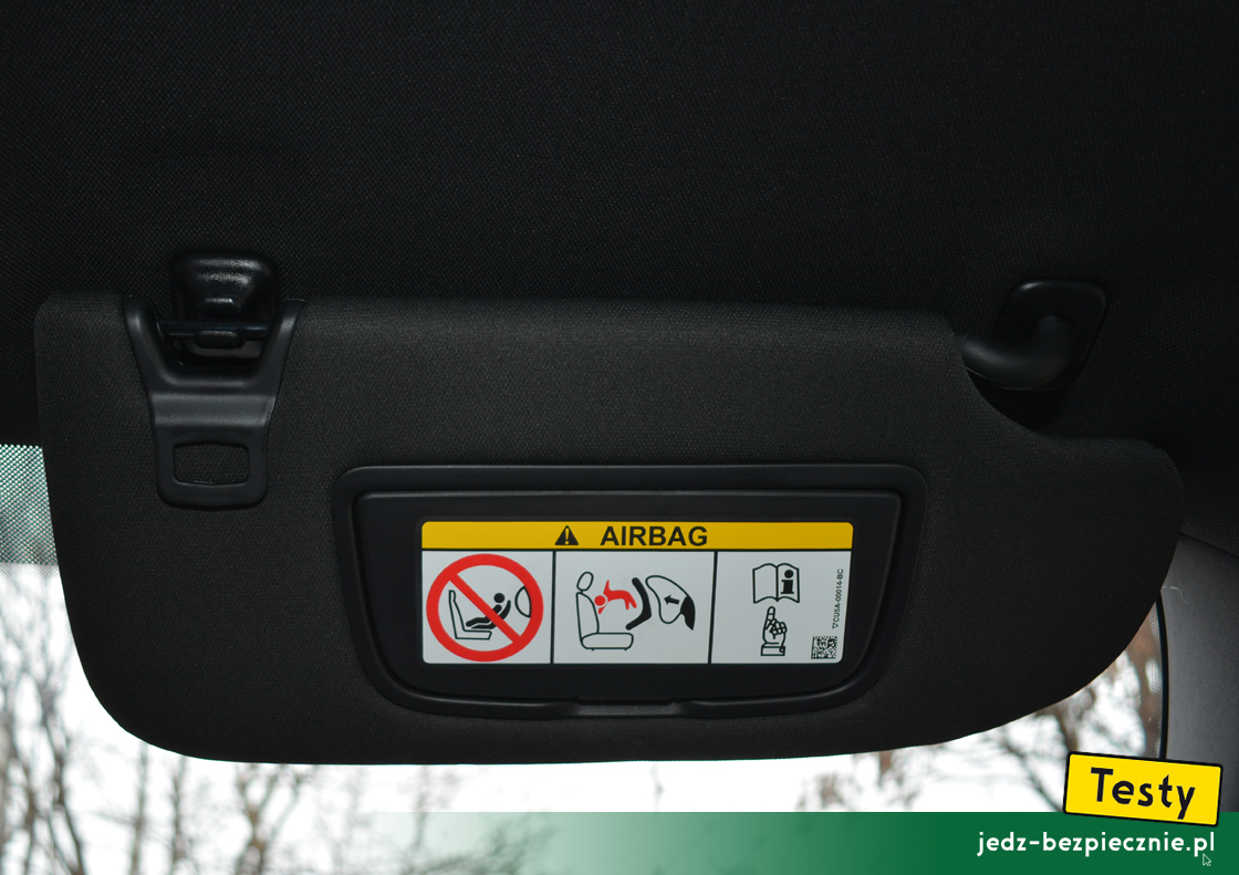 Testy - Ford S-Max hybrid - ostrzeżenie na osłonie przeciwsłonecznej pasażera
